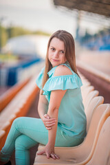 Wall Mural - Portrait of a young beautiful girl in a summer park.