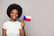 © millaf - Czech woman holding flag of Czech Republic Education, business, citizenship and patriotism concept