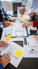 close-up ux developers and ui designers use augmented reality to brainstorm on mobile app interface 