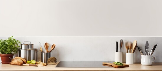 Aufkleber - A front view image of a modern kitchen with various kitchen utensils placed on a clean white countertop. blank space available for adding text.