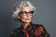 © Jorge Ferreiro - stylish mature woman looking at camera in studio