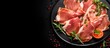© HN Works - Top view of Italian Prosciutto Cotto with pork ham slices on a black background, ready to be served. copy space available.