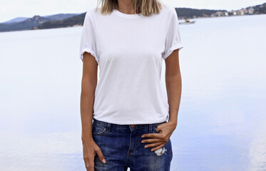 Poster - White t shirt mockup with copy space. Woman's blank white tshirt template with lake background 