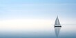 © Natart - Sailboat in the sea on a background of blue sky. Minimalist sailing background. A lonely sailing boat floating in the ocean.