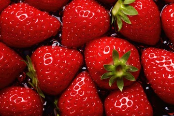 Wall Mural - Fresh wet sweet strawberry on black background. Colorful fruit pattern. Creative berries concept. Vegan food. Flat lay, top view