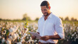 © Studio Nova - Man farmer standing the field of cotton and using tablet computer. Agricultural concept.