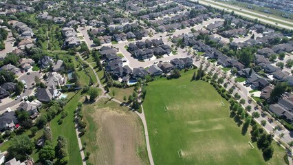 Sticker - Rotating drone footage of city houses roofs with trees in Saskatoon, Canada