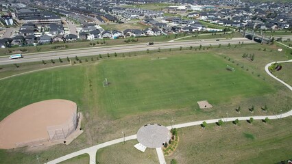 Poster - Aerial view of suburban buildings and houses with trees in Saskatoon, Canada