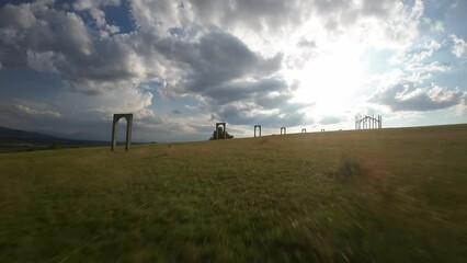 Poster - Drone shot around Big cellar monument with green landscape of hills, Hungary