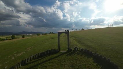 Canvas Print - Drone shot around Big cellar monument with green landscape of hills, Hungary