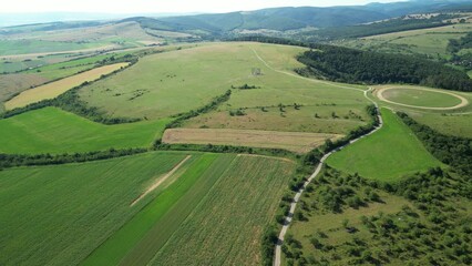 Sticker - Aerial landscape of vast plains and lawn fields with green hills