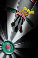 Wall Mural - 3 mini darts in a triple ring on a dartboard.