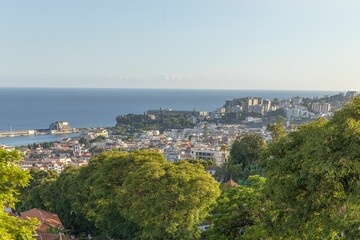 Poster - Aerial view of a cityscape, featuring its bay and residential area on a sunny day ,Madeira Island