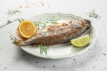 Wall Mural - Appetizing fried dorado fish. Restaurant menu, dieting, cookbook recipe top view