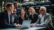 © borisk.photos - Cheerful Business Colleagues Watching a Presentation on a Laptop
