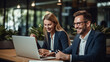 © borisk.photos - Cheerful Business Colleagues Watching a Presentation on a Laptop