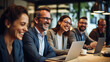 © borisk.photos - Cheerful Business Colleagues Watching a Presentation on a Laptop