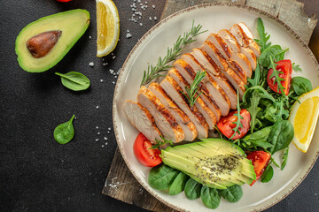 Wall Mural - Roasted Chicken Fillet, green lettuce, arugula, tomatoes. Ketogenic diet. Low carb high fat breakfast. Healthy food concept. place for text, top view