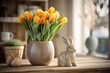 A close up image of a trendy rabbit and tulips placed on a wooden table. Wishing you a joyful Easter! A beautiful bouquet made of tulips and willow branches adorned with Easter decorations can be