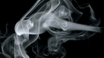 Wall Mural - horizontal smoke burning and swirling in soft ethereal shapes. real smoke on black background.