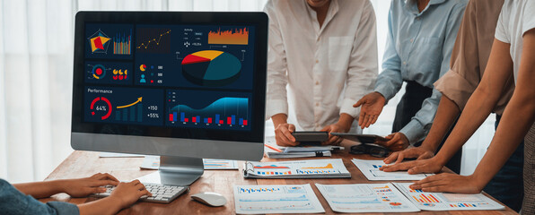 Leinwandbilder - Panorama shot analyst team utilizing BI Fintech to analyze financial report with laptop. Businesspeople analyzing BI power dashboard displayed on laptop screen for business insight. Scrutinize