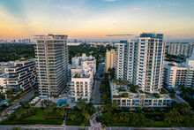 Miami Beach, Florida, USA - Morning Aerial View Of Luxury Condominiums With The Miami Skyline In The Distance.