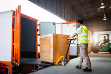 Workers Unloading Heavy Box Into Container Truck. Trucks Loading Dock Warehouse. Supply Chain,  Package Boxes Shipment, Supplies Warehouse. Freight Truck Logistic, Cargo Transport, Warehouse Shipping.