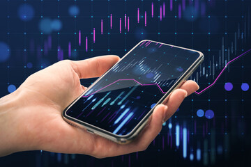 Wall Mural - Close up of woman hand holding mobile phone with glowing growing forex chart on blurry background. Trade, finance and stock market concept.