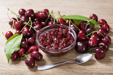 Wall Mural - Bowl of cherry jam with fresh fruits