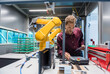 © Westend61 - Businessman checking industrial robot in high tech company