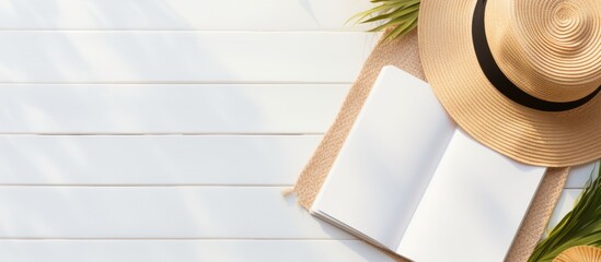 Poster - Flat lay with copy space featuring a blank writing book with summer beach accessories in the background.