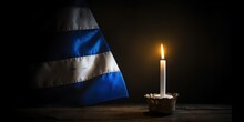 Burning Candle And Flag Of Israel On A Dark Background.