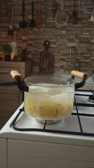 Wall Mural - Removing the pasta from the pan with boiling water