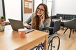 © Krakenimages.com - Young beautiful hispanic woman business worker talking on smartphone sitting on wheelchair at office
