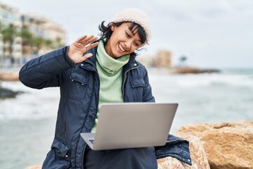 Sticker - Young beautiful hispanic woman smiling confident having video call at seaside