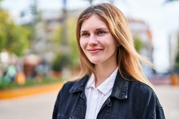 Sticker - Young blonde woman smiling confident looking to the side at park