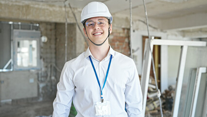 Sticker - Young hispanic man architect smiling confident standing at construction site