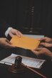 .Business and lawyers discussing contract papers with brass scale on desk in office. Law, legal services, advice, justice and law concept picture with film grain effect