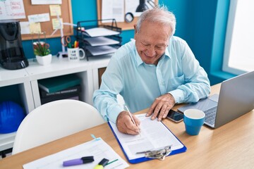 Poster - Middle age grey-haired man business worker using laptop writing on document at office