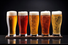 Five Beer Glasses With Different Types On A Black Background