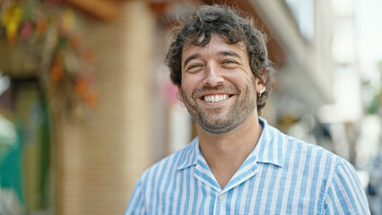 Poster - Young hispanic man smiling confident standing at street