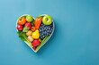 Heartshaped Plate With Fruits And Vegetables On Blue Background, Top View