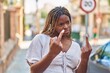 © Krakenimages.com - African american woman doing bad gesture with fingers at street