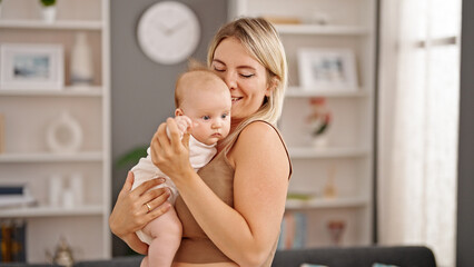 Sticker - Mother and daughter hugging each other standing at home