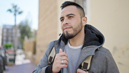 Sticker - Hispanic man smiling confident looking to the side at street