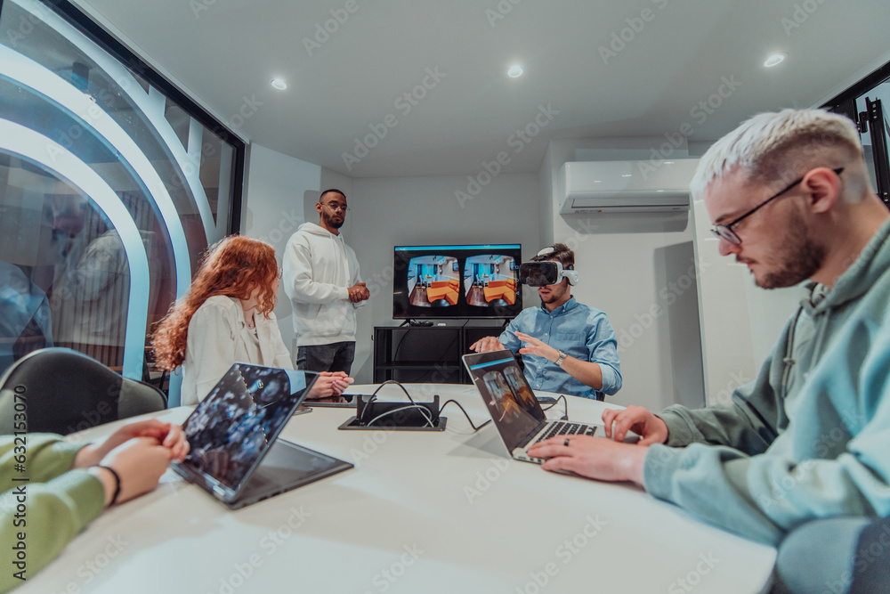 A diverse group of businessmen collaborates and tests a new virtual ...
