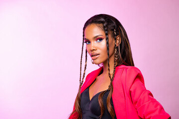 Wall Mural - Fashion Portrait Black Woman in Pink clothes. Fashion Makeup curly hair and braids, lip gloss. Luxury Fashion model African American posing in studio, pink wall. 