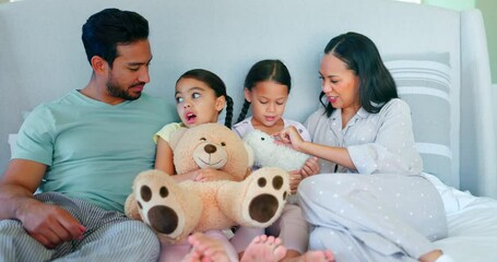 Wall Mural - Bed, happy family and parents with love for children and playing with a teddy bear toy together in a bedroom. Care, mother and father bonding with kids in a room for support, morning and security