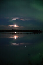 Moonlight And The Gemini Constellation Over The Lake