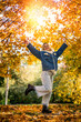 © RomanR - Pretty woman alone walking outdoors in autumn park, enjoy free time at nature
